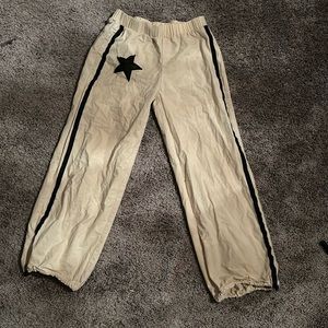 tan track pants with cute star patch